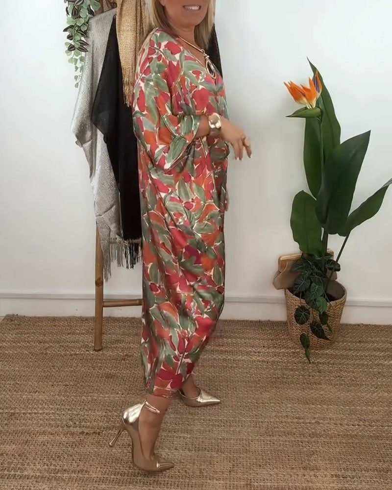 Kleid Mit V-Ausschnitt Und Gedrehtem Print-Design