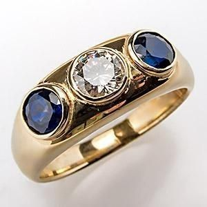 Goldring mit Zirkon und blauem Kristall